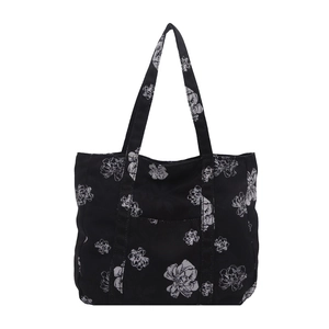 Large black canvas tote bag with white floral art print for daily casual commute