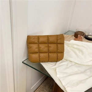 Minimalist brown quilted puffer pouch with padded lattice texture for daily storage
