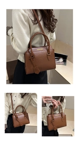 Brown snakeskin embossed handbag with top handle and shoulder strap in three views