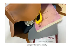 Macro shot showing the spacious interior of the brown tote bag for books and gadgets