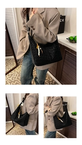Detail of faux suede leopard print tote bag with beaded fringe charm and crossbody strap
