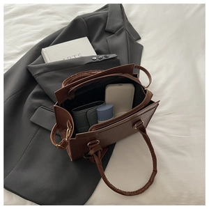 Top view of dark brown tote bag showing interior compartments and spacious storage capacity