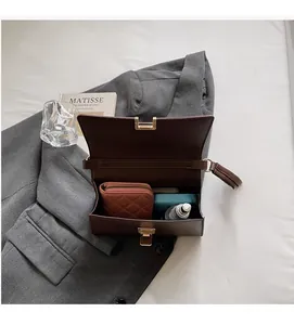 Detail view of the open spacious interior of this brown leather baguette bag for women