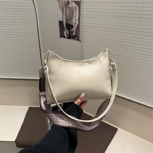 Minimalist cream crescent shoulder bag with a vintage geometric jacquard wide strap