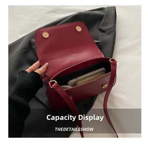 Interior view showing the capacity for a phone and wallet in this red shoulder bag