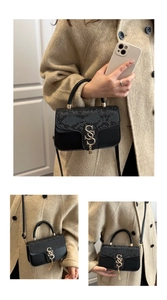 Three-way view of a black snakeskin embossed crossbody bag with S-shaped gold hardware
