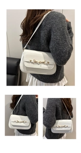 Three-way view of a white PU leather shoulder bag featuring a gold horsebit buckle
