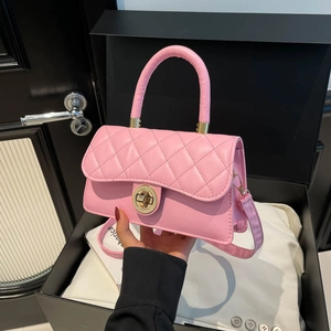 Pink quilted leather tote bag with gold twist lock and shoulder strap in gift box