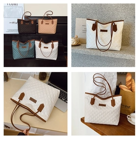 Detail view of quilted tote bags in black, beige, teal, and white with brown straps