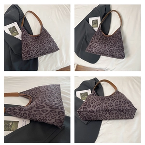 Detailed views of leopard print tote bag with brown leather handles and zipper detail