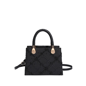 Classic black quilted square handbag with glitter texture and gold metal handle hardware