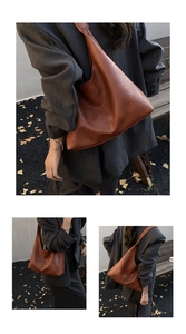 Detail of caramel tote bag with leather texture and embossed FASHION & LEATHER text
