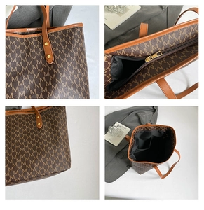 Detailed view of vintage monogram tote bag featuring leather trim and gold zipper hardware