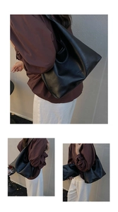 Detail view of black vintage tote bag with matching pouch and minimalist text