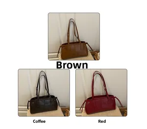 Detailed view of large capacity vintage leather tote bags in brown, coffee, and red colors