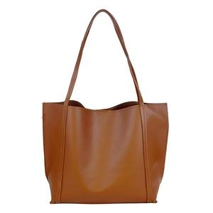 Minimalist brown leather tote bag with a trapezoid shape and long shoulder straps