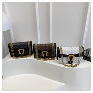 Detailed view of vintage chain bags in black, coffee, and white with M-pattern jacquard fabric