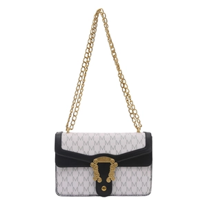 Classic black and white checkered shoulder bag with gold chain strap and metal clasp
