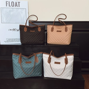 Quilted tote bags in black, khaki, and white with elegant leather straps for daily commute