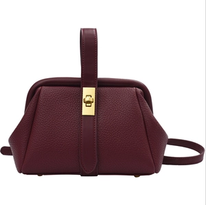 Classic burgundy lychee pattern leather handbag with elegant gold turn-lock closure