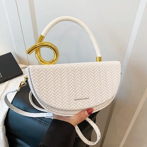 White woven saddle bag with gold ring handle and crossbody strap for women