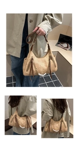 Detail view of camel hobo bag featuring decorative pearl chain and long zipper tassels
