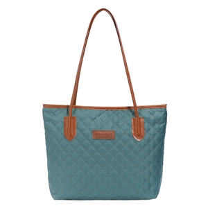 Teal quilted tote bag with brown leather straps and fashion label on white background