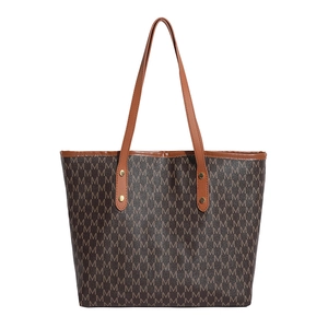 Brown tote bag with repeated M pattern and gold rivet accents for casual commuting