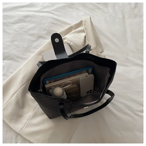 Spacious tote bag interior showing capacity for tablet, umbrella, and daily essentials