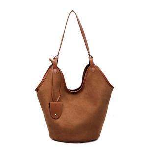 Minimalist caramel brown suede tote bag featuring a spacious design and smooth leather straps