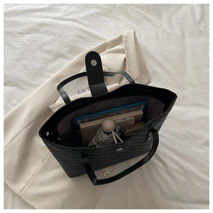 Spacious tote bag with jacquard M-pattern showing tablet, umbrella and essentials inside