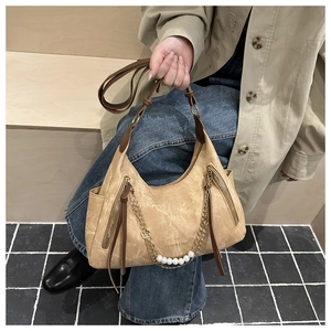 Detail of khaki suede tote with pearl chain and Fashion & Bags gold metallic lettering