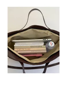 Top view of deep brown tote bag interior showing large capacity for laptop and books