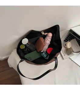 Interior view of brown tote bag showing large capacity for umbrella and wallet