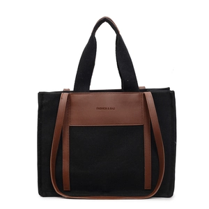 Large capacity canvas tote bag with brown leather trim and shoulder straps for daily use