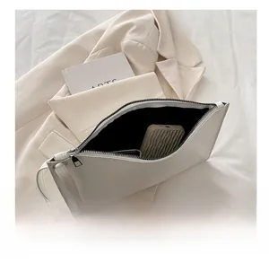 Detailed internal view of white minimalist tote bag showing large storage capacity