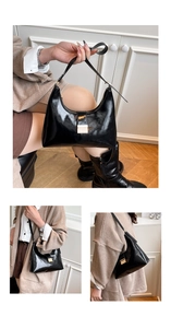 Detail of glossy black crescent bag with gold hardware and adjustable strap