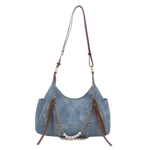 Blue denim tote bag with brown leather strap and decorative pearl gold chain