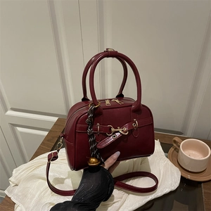 Retro burgundy shell shoulder bag with golden horsebit and adjustable strap for women