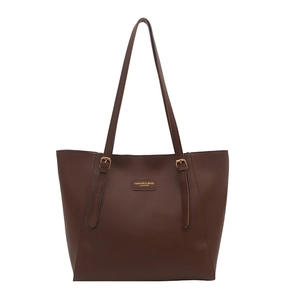 Classic dark brown leather tote bag with adjustable straps and gold logo on white background