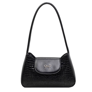 Black crocodile embossed leather underarm bag with a silver bow and sleek shoulder strap