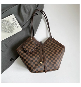 Detail of checkered tote bag with matching round pouch on a minimalist art background