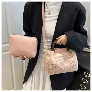 Pink shearling tote bag set with wooden handles and matching leather clutch purse