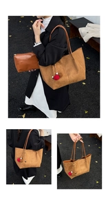 Detail of caramel suede tote bag with matching pouch and plush charm decoration