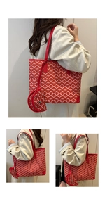 Detail of red tote bag with chevron pattern including matching small coin purse pouch