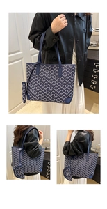 Detail of navy blue tote bag featuring Y-pattern texture and a matching small pouch