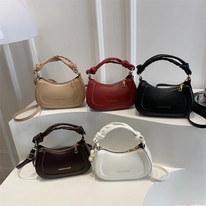 Minimalist faux leather crossbody handbags in five colors with twisted handles and gold hardware
