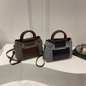 Retro houndstooth tote bags in brown and black with wood-grain handles and long shoulder straps