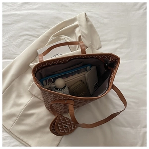 Brown tote bag with geometric print showing large capacity for tablet and umbrella