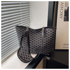 Detail view of printed tote bag and mini pouch with geometric pattern in gray and white